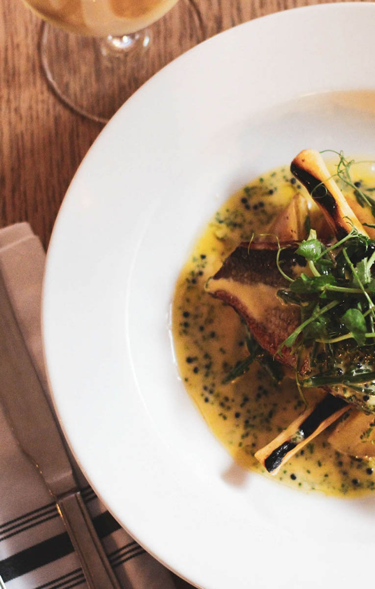 A plated fish dish from The Five Dials kitchen