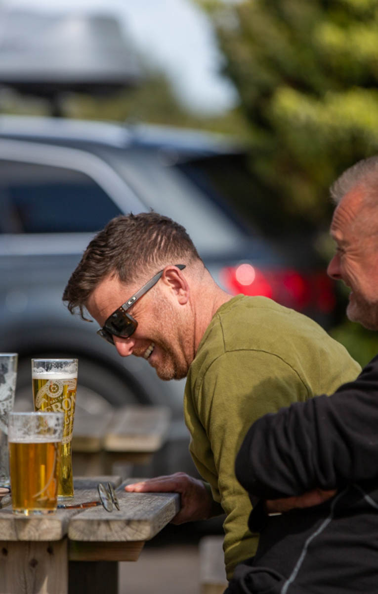 A guest enjoying a pint outside The Five Dials